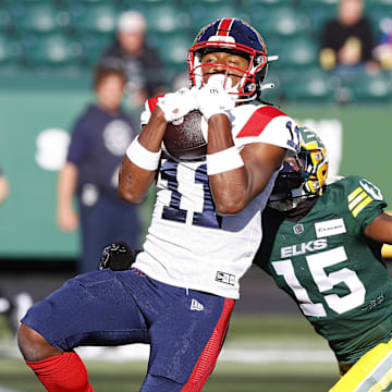 Jun 14, 2024; Edmonton, Alberta, CAN; Montreal Alouettes wide receiver Kaion Julien-Grant (11) catches a ball in front of Edmonton Elks during the first half at Commonwealth Stadium. Mandatory Credit: Perry Nelson-Imagn Images