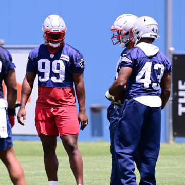 Jun 10, 2024; Foxborough, MA, USA;  New England Patriots defensive end Keion White (99) works with the defense at minicamp at Gillette Stadium. Mandatory Credit: Eric Canha-USA TODAY Sports