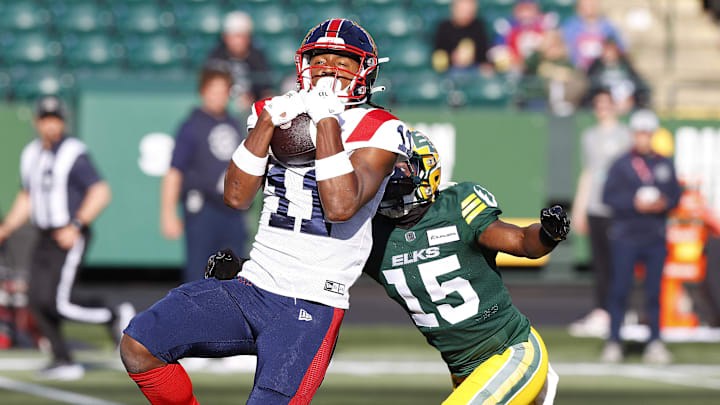 Jun 14, 2024; Edmonton, Alberta, CAN; Montreal Alouettes wide receiver Kaion Julien-Grant (11) catches a ball in front of Edmonton Elks during the first half at Commonwealth Stadium. Mandatory Credit: Perry Nelson-Imagn Images