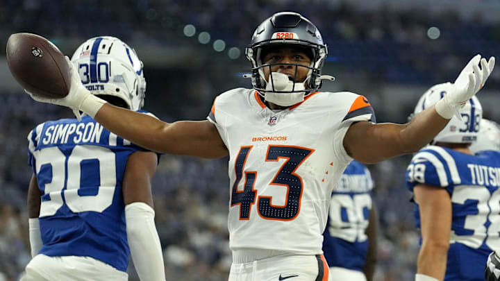 Denver Broncos running back Blake Watson (43) celebrates after scoring a touchdown against the Indianapolis Colts during the second half of a preseason game Sunday, Aug. 11, 2024, at Lucas Oil Stadium in Indianapolis. The Broncos defeated the Colts 34-30.