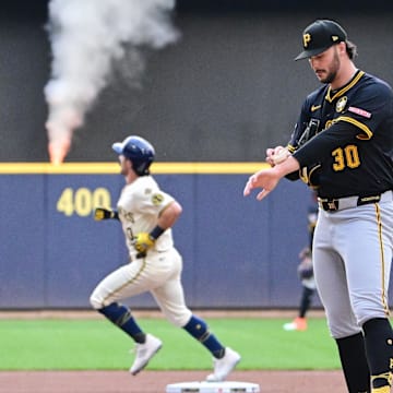 Aug 12, 2025; Milwaukee, Wisconsin, USA;  Pittsburgh Pirates starting pitcher Paul Skenes (30) reacts after giving up a solo home run to Milwaukee Brewers right fielder Sal Frelick (10) in the first inning at American Family Field. Mandatory Credit: Benny Sieu-Imagn Images