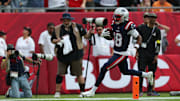 Nov 9, 2025; Tampa, Florida, USA; New England Patriots wide receiver Kyle Williams (18) runs for a touchdown during the second quarter against the Tampa Bay Buccaneers at Raymond James Stadium. Mandatory Credit: Nathan Ray Seebeck-Imagn Images