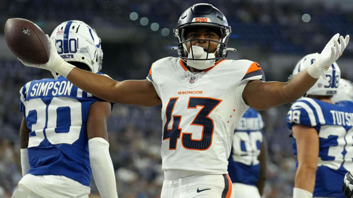 Denver Broncos running back Blake Watson (43) celebrates after scoring a touchdown against the Indianapolis Colts during the second half of a preseason game Sunday, Aug. 11, 2024, at Lucas Oil Stadium in Indianapolis. The Broncos defeated the Colts 34-30.