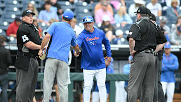 Jun 19, 2024; Omaha, NE, USA;  Florida Gators head coach Kevin O'Sullivan greets Kentucky Wildcats head coach Nick Mingione before the game at Charles Schwab Field Omaha. Mandatory Credit: Steven Branscombe-Imagn Images