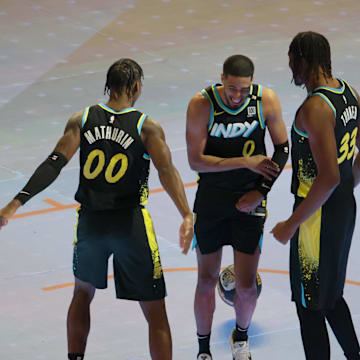 Feb 17, 2024; Indianapolis, IN, USA; Indiana Pacers guard Tyrese Haliburton (0) celebrates with guard Bennedict Mathurin (00) and center Myles Turner (33) during the Kia Skills Challenge during NBA All Star Saturday Night at Lucas Oil Stadium. Mandatory Credit: Trevor Ruszkowski-Imagn Images