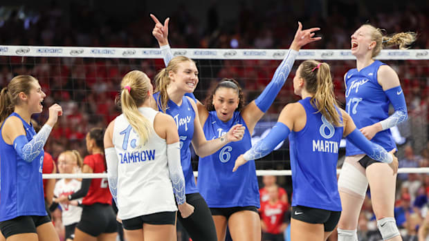 Creighton players celebrate a point against No. 1 Nebraska.