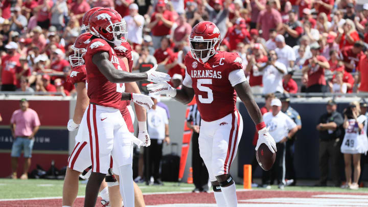 Sep 2, 2023; Little Rock, Arkansas, USA; Arkansas Razorbacks running back Raheim Sanders (5) celebrates after scoring a touchdown in the first quarter against the Western Carolina Catamounts at War Memorial Stadium. Mandatory Credit: Nelson Chenault-USA TODAY Sports