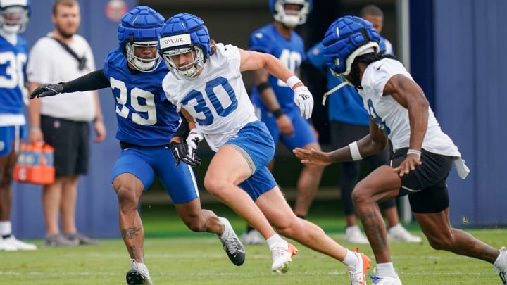 Indianapolis Colts Jaylin Simpson (30) rushes up the field against Darrell Baker Jr. (39) on Wednesday, June 5, 2024, during practice at the Colts Practice Facility in Indianapolis.