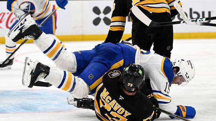 Apr 23, 2026; Boston, Massachusetts, USA; Buffalo Sabres center Peyton Krebs (19) collides with Boston Bruins defenseman Charlie McAvoy (73) during the second period of game three of the first round of the 2026 Stanley Cup Playoffs at the TD Garden. Mandatory Credit: Brian Fluharty-Imagn Images