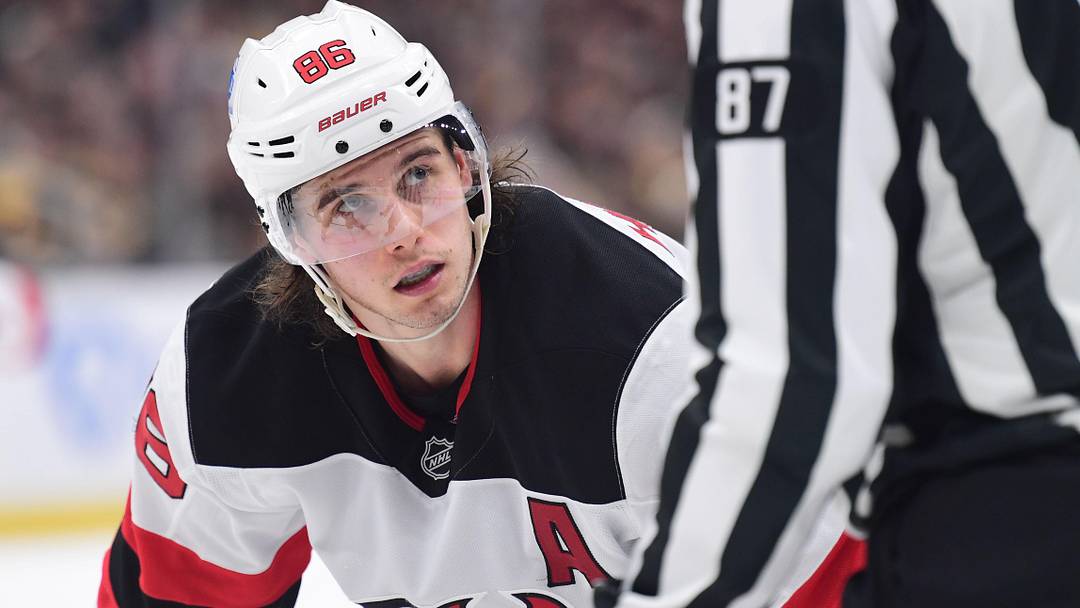New Jersey Devils center Jack Hughes (86) looks at the linesman before a face-off during the second period against the Boston Bruins at TD Garden. Mandatory Credit: Bob DeChiara-Imagn Images