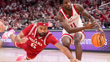 Louisville guard Kobe Rodgers grabs the ball from Indiana guard Tayton Conerway on, Dec. 6, 2025, at Gainbridge Fieldhouse in Indianapolis.