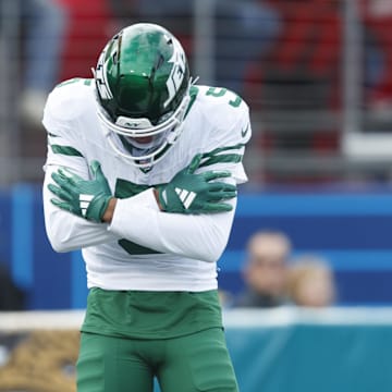 Dec 15, 2024; Jacksonville, Florida, USA; New York Jets wide receiver Garrett Wilson (5) celebrates a touchdown against the Jacksonville Jaguars during the first quarter at EverBank Stadium. Mandatory Credit: Morgan Tencza-Imagn Images