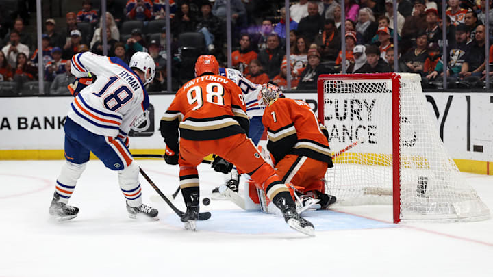 Feb 25, 2026; Anaheim, California, USA;  Edmonton Oilers left wing Zach Hyman (18) attacks a goal against Anaheim Ducks goaltender Lukas Dostal (1) during the first period at Honda Center. Mandatory Credit: Kiyoshi Mio-Imagn Images