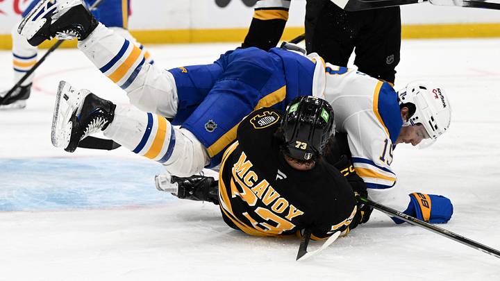 Apr 23, 2026; Boston, Massachusetts, USA; Buffalo Sabres center Peyton Krebs (19) collides with Boston Bruins defenseman Charlie McAvoy (73) during the second period of game three of the first round of the 2026 Stanley Cup Playoffs at the TD Garden. Mandatory Credit: Brian Fluharty-Imagn Images