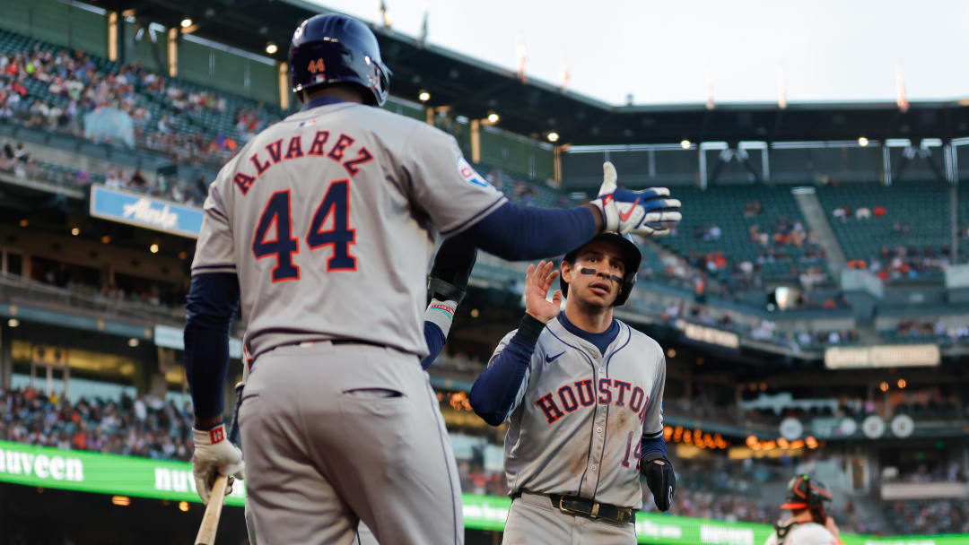 Jun 11, 2024; San Francisco, California, USA; Houston Astros outfielder Mauricio Dubón (14) celebrates with outfielder Yordan Alvarez (44) after scoring a run during the fifth inning against the San Francisco Giants at Oracle Park.