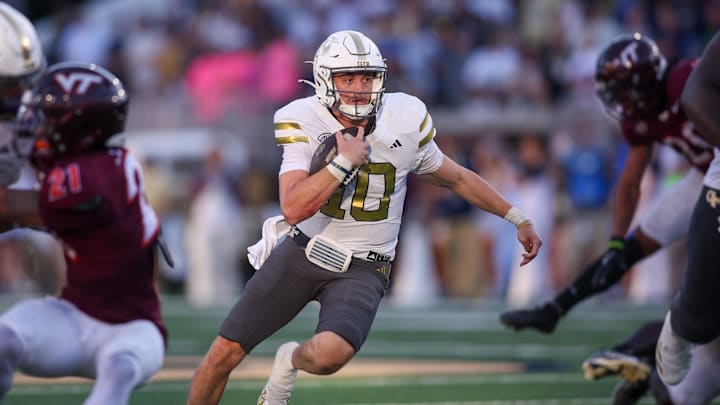 Oct 11, 2025; Atlanta, Georgia, USA; Georgia Tech Yellow Jackets quarterback Haynes King (10) runs the ball for a touchdown against the Virginia Tech Hokies in the fourth quarter at Bobby Dodd Stadium at Hyundai Field. Mandatory Credit: Brett Davis-Imagn Images
