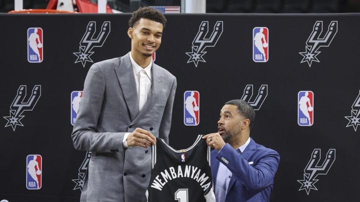 Jun 24, 2023; San Antonio, TX, USA; San Antonio Spurs draft pick Victor Wembanyama holds a jersey with general manager Brian Wright during a press conference at AT&T Center. Jun 24, 2023; San Antonio, TX, USA; San Antonio Spurs draft pick Victor Wembanyama holds a jersey with general manager Brian Wright during a press conference at AT&T Center.