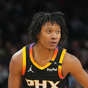 Feb 11, 2025; Phoenix, Arizona, USA; Phoenix Suns guard TyTy Washington Jr. (14) dribbles against the Memphis Grizzlies during the first half at Footprint Center. Mandatory Credit: Joe Camporeale-Imagn Images