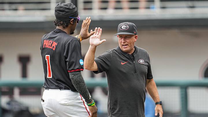 May 29, 2026; Athens, GA, USA; Georgia Bulldogs head coach Wes Johnson reacts with Georgia Bulldogs infielder Tre Phelps (1) on the field prior to the game against the LIU Sharks at Foley Field. Mandatory Credit: Dale Zanine-Imagn Images