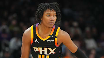 Feb 11, 2025; Phoenix, Arizona, USA; Phoenix Suns guard TyTy Washington Jr. (14) dribbles against the Memphis Grizzlies during the first half at Footprint Center. Mandatory Credit: Joe Camporeale-Imagn Images