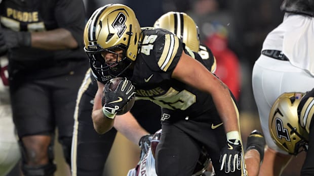 Purdue Boilermakers running back Devin Mockobee (45) jumps into the end zone for a touchdown 