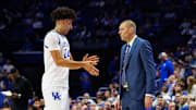 Nov 4, 2025; Lexington, Kentucky, USA; Kentucky Wildcats center Malachi Moreno (24) talks with head coach Mark Pope during the second half against the Nicholls Colonels at Rupp Arena at Central Bank Center. Mandatory Credit: Jordan Prather-Imagn Images