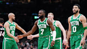 Apr 24, 2024; Boston, Massachusetts, USA; Boston Celtics guard Jaylen Brown (7), forward Jayson Tatum (0), guard Derrick White (9) and forward Sam Hauser (30) walk to the bench during a timeout against the Miami Heat in the second quarter during game two of the first round for the 2024 NBA playoffs at TD Garden. Mandatory Credit: David Butler II-Imagn Images