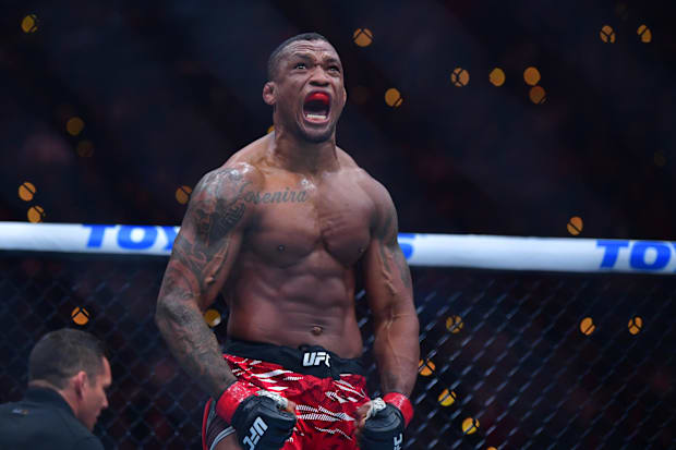 Jailton Almeida (red gloves) celebrates after defeating Serghei Spivac (blue gloves) during UFC 311 at Intuit Dome. 
