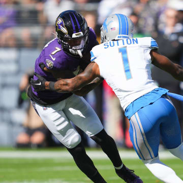 Baltimore Ravens wide receiver Rashod Bateman (7) is tackled by Detroit Lions cornerback Cam Sutton (1).