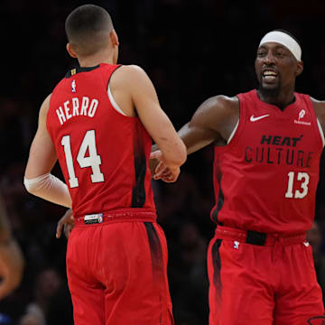 Dec 7, 2024; Miami, Florida, USA;  Miami Heat center Bam Adebayo (13) celebrates with guard Tyler Herro (14) after Herro made a three-point basket against the Phoenix Suns during the second half at Kaseya Center. Mandatory Credit: Jim Rassol-Imagn Images