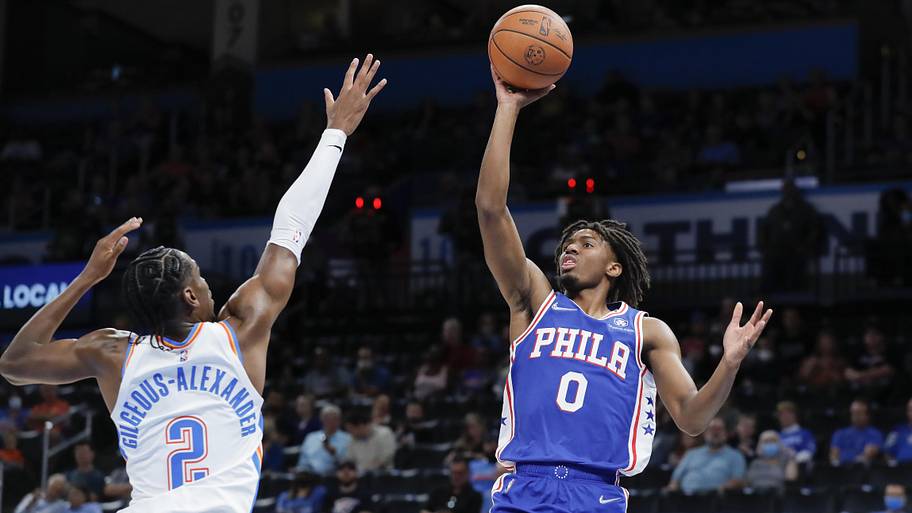 Philadelphia 76ers guard Tyrese Maxey shoots as Oklahoma City Thunder guard Shai Gilgeous-Alexander defends.