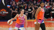 Clark, left, dribbles alongside Reese during the WNBA All Star Game at Footprint Center.