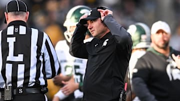 Nov 22, 2025; Iowa City, Iowa, USA; Michigan State Spartans head coach Jonathan Smith talks with an official during the second quarter against the Michigan State Spartans at Kinnick Stadium. Mandatory Credit: Jeffrey Becker-Imagn Images