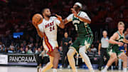 Oct 6, 2025; Miami, Florida, USA; Miami Heat guard Norman Powell (24) drives to the basket against Milwaukee Bucks center Myles Turner (3) during the second quarter at Kaseya Center. Mandatory Credit: Sam Navarro-Imagn Images