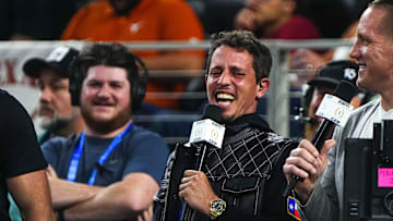 Comedian Tony Hinchcliffe laughs on the sideline during the College Football Playoff semifinal game between the Texas Longhorns and Ohio State in the Cotton Bowl at AT&T Stadium.