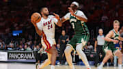 Oct 6, 2025; Miami, Florida, USA; Miami Heat guard Norman Powell (24) drives to the basket against Milwaukee Bucks center Myles Turner (3) during the second quarter at Kaseya Center. Mandatory Credit: Sam Navarro-Imagn Images
