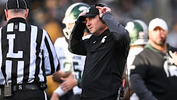 Nov 22, 2025; Iowa City, Iowa, USA; Michigan State Spartans head coach Jonathan Smith talks with an official during the second quarter against the Michigan State Spartans at Kinnick Stadium. Mandatory Credit: Jeffrey Becker-Imagn Images