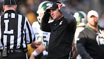 Nov 22, 2025; Iowa City, Iowa, USA; Michigan State Spartans head coach Jonathan Smith talks with an official during the second quarter against the Michigan State Spartans at Kinnick Stadium. Mandatory Credit: Jeffrey Becker-Imagn Images