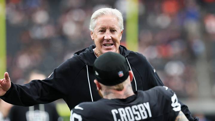 Sep 28, 2025; Paradise, Nevada, USA; Las Vegas Raiders defensive end Maxx Crosby (98) high fives head coach Pete Carroll prior to the game against the Chicago Bears at Allegiant Stadium. Mandatory Credit: Kiyoshi Mio-Imagn Images