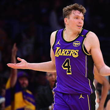 Nov 19, 2024; Los Angeles, California, USA; Los Angeles Lakers guard Dalton Knecht (4) react after scoring a three point basket against the Utah Jazz during the second half at Crypto.com Arena. Mandatory Credit: Gary A. Vasquez-Imagn Images