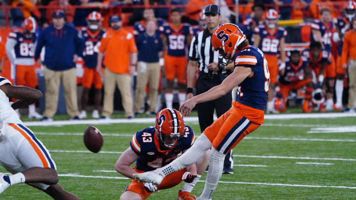 Sep 23, 2022; Syracuse, New York, USA; Syracuse Orange place kicker Andre Szmyt (91) kicks a field goal with defensive back Cornell Perry (43) holding during the second half against the Virginia Cavaliers at JMA Wireless Dome. Mandatory Credit: Gregory Fisher-USA TODAY Sports