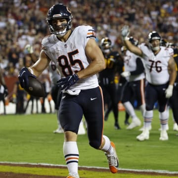 Cole Kmet scores a touchdown against Washington as the Bears break out to a big lead. They face the Commanders again this year.