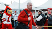 Louisville football coach Jeff Brohm leads the team as the Cards head to the locker room at the Cards March before the Louisville football game against Clemson at L&N Stadium Friday. Nov. 14, 2025