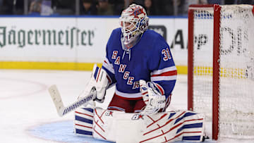 May 13, 2024; New York, New York, USA; New York Rangers goaltender Igor Shesterkin (31) makes a save against the Carolina Hurricanes during the third period of game five of the second round of the 2024 Stanley Cup Playoffs at Madison Square Garden. Mandatory Credit: Brad Penner-Imagn Images