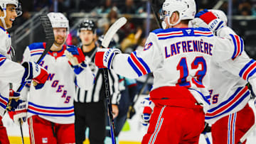 Nov 17, 2024; Seattle, Washington, USA; New York Rangers left wing Alexis Lafrenière (13) celebrates after scoring a goal against the Seattle Kraken during the second period at Climate Pledge Arena. Mandatory Credit: Joe Nicholson-Imagn Images