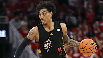 Feb 8, 2025; Louisville, Kentucky, USA; Louisville Cardinals guard Terrence Edwards Jr. (5) dribbles against the Miami (Fl) Hurricanes during the second half at KFC Yum! Center. Louisville defeated Miami 88-78. 