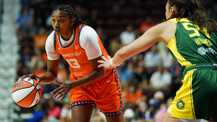 Connecticut Sun center Rayah Marshall (13) looks for an opening against Seattle Storm forward Mackenzie Holmes (54) in the second half at Mohegan Sun Arena. Connecticut Sun center Rayah Marshall (13) looks for an opening against Seattle Storm forward Mackenzie Holmes (54) in the second half at Mohegan Sun Arena.