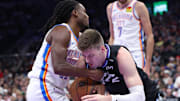 Nov 21, 2025; Salt Lake City, Utah, USA; Oklahoma City Thunder guard Cason Wallace (22) and Utah Jazz forward Kyle Filipowski (22) battle for the ball during the first half at Delta Center. Mandatory Credit: Rob Gray-Imagn Images