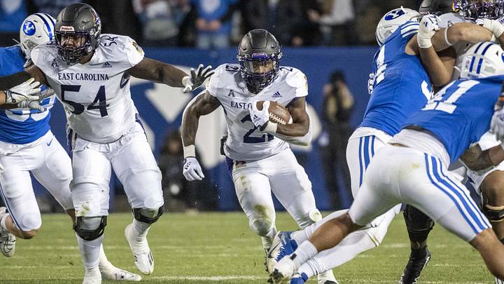 Oct 28, 2022; Provo, Utah, USA; East Carolina Pirates running back Marlon Gunn, Jr. (21) runs during the fourth quarter against the BYU Cougars at LaVell Edwards Stadium. Mandatory Credit: Christopher Creveling-Imagn Images