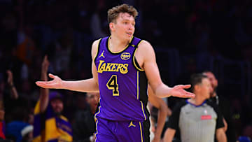 Nov 19, 2024; Los Angeles, California, USA; Los Angeles Lakers guard Dalton Knecht (4) react after scoring a three point basket against the Utah Jazz during the second half at Crypto.com Arena. Mandatory Credit: Gary A. Vasquez-Imagn Images
